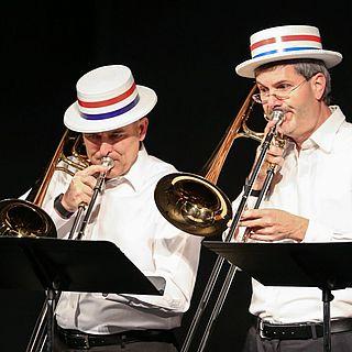 President McVay plays trombone with another faculty member